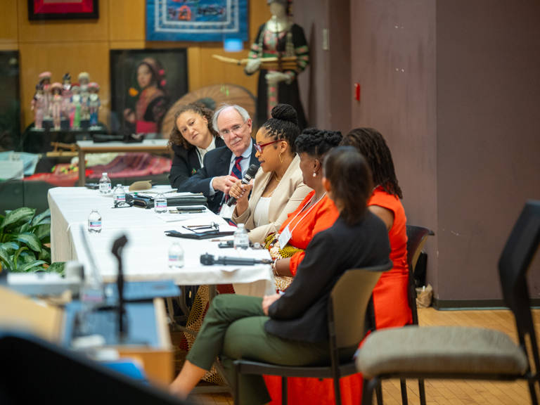 Karla McKanders speaks into a microphone during the panel “History Is a Call to Action: Building the Record and Imagining the Future”
